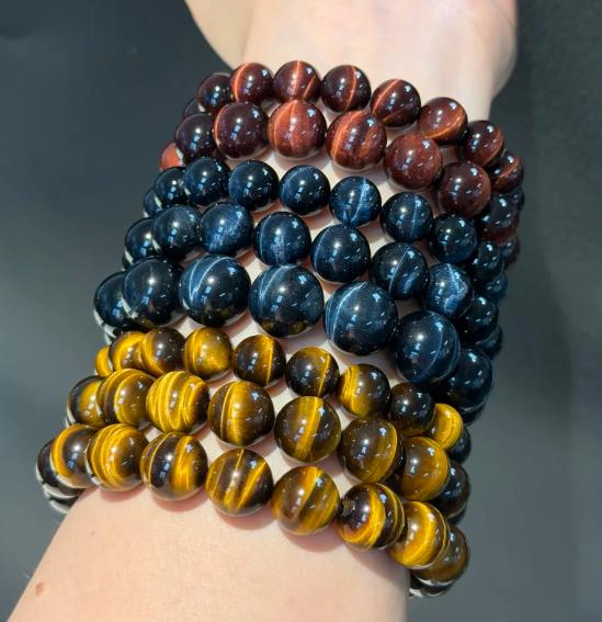 Tiger eye and hawk eye bracelets stacked: gold, blue and red colourways